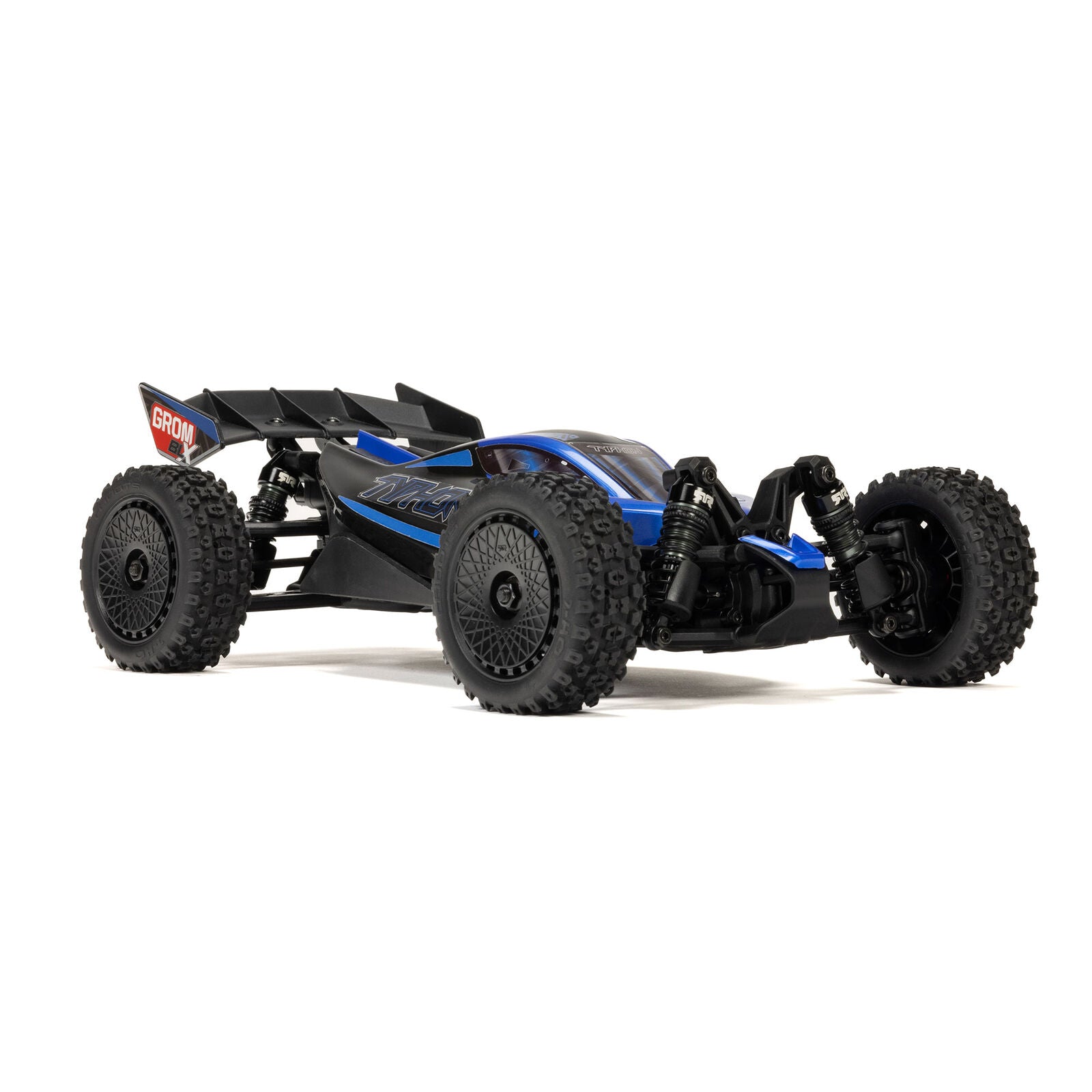 ARRMA Typhon Grom BLX red/black action shot on dry grass
