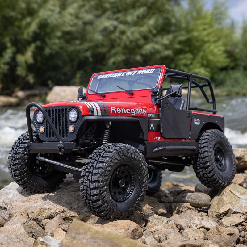 Axial SCX10 III Jeep CJ-7 Red Renegade crawling over rocks outdoors